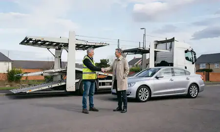 Vehicle owner beside their delivered car in Fareham, Hampshire, United Kingdom