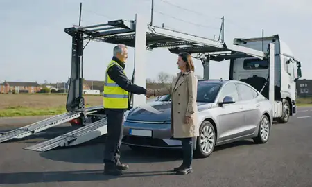 Vehicle owner beside their delivered car in Farnborough, Hampshire, United Kingdom