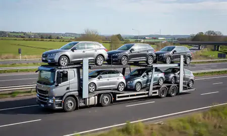 Multi-level car carrier on the motorway to Fleet, Hampshire, United Kingdom