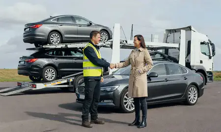 Vehicle owner beside their delivered car in Fleet, Hampshire, United Kingdom