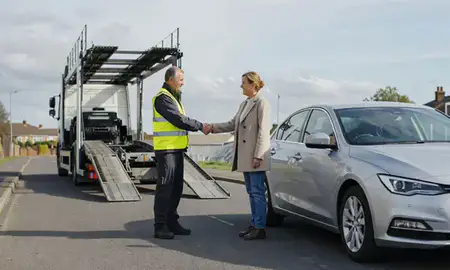 Vehicle owner beside their delivered car in Havant, Hampshire, United Kingdom