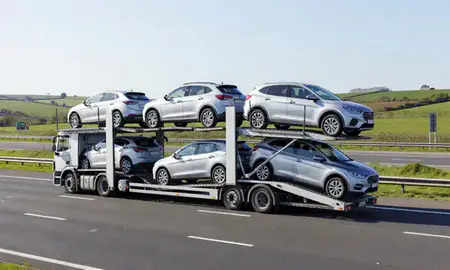 Multi-level car carrier on the motorway to Horndean, Hampshire, United Kingdom