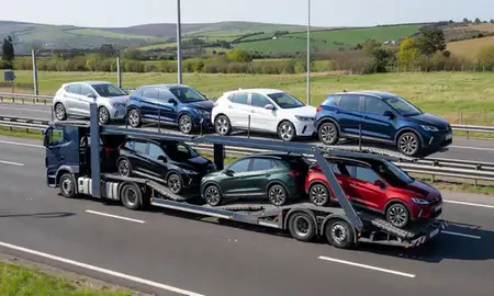 Multi-level car carrier on the motorway to Hereford, Herefordshire, United Kingdom