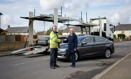 Vehicle owner beside their delivered car in Hereford, Herefordshire, United Kingdom