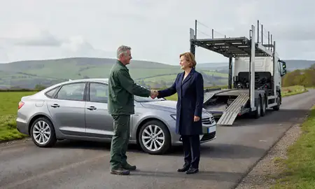 Vehicle owner beside their delivered car in Hertfordshire, United Kingdom