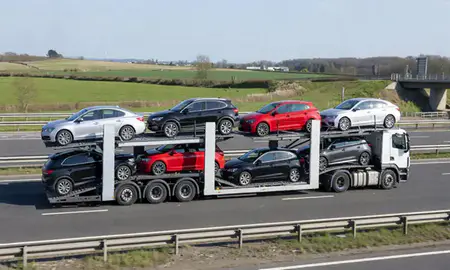 Multi-level car carrier on the motorway to Bishop's Stortford, Hertfordshire, United Kingdom