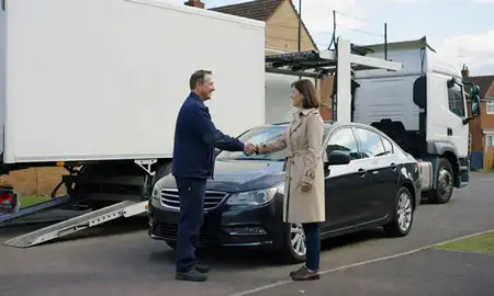 Vehicle owner beside their delivered car in Bishop's Stortford, Hertfordshire, United Kingdom