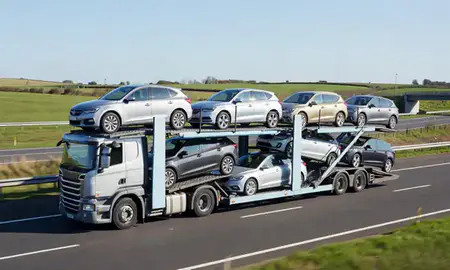 Multi-level car carrier on the motorway to Borehamwood, Hertfordshire, United Kingdom