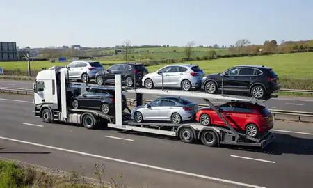 Multi-level car carrier on the motorway to Cheshunt, Hertfordshire, United Kingdom