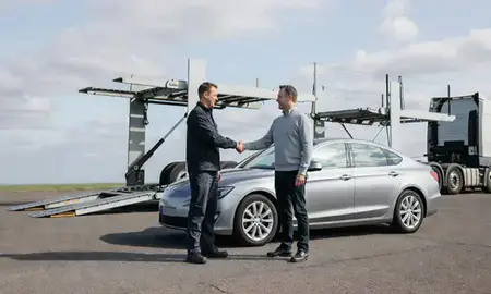 Vehicle owner beside their delivered car in Cheshunt, Hertfordshire, United Kingdom