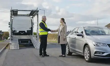 Vehicle owner beside their delivered car in Hatfield, Hertfordshire, United Kingdom