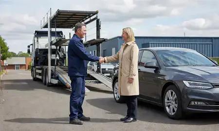 Vehicle owner beside their delivered car in Hemel Hempstead, Hertfordshire, United Kingdom