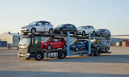 Car transporter loaded with vehicles in Hitchin, Hertfordshire, United Kingdom