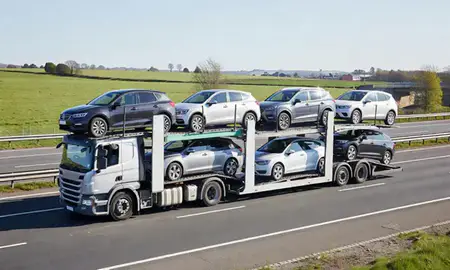 Multi-level car carrier on the motorway to Hoddesdon, Hertfordshire, United Kingdom