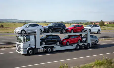 Multi-level car carrier on the motorway to Watford, Hertfordshire, United Kingdom