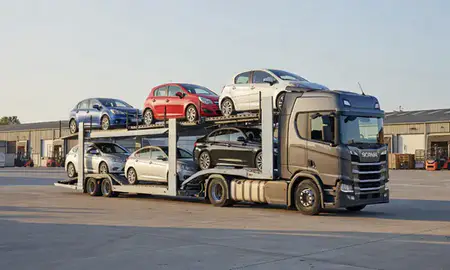 Car transporter loaded with vehicles in Watford, Hertfordshire, United Kingdom