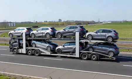 Multi-level car carrier on the motorway to Welwyn Garden City, Hertfordshire, United Kingdom