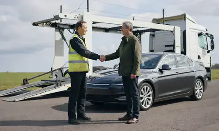 Vehicle owner beside their delivered car in Hertfordshrie, United Kingdom