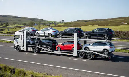 Multi-level car carrier on the motorway to Inverness, Highland, United Kingdom