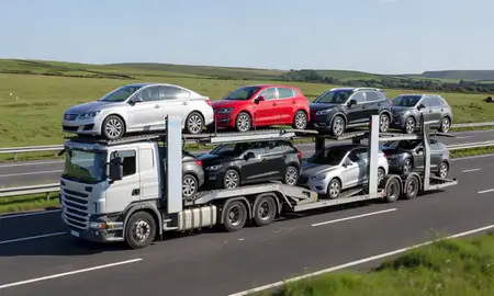 Multi-level car carrier on the motorway to Greenock, Inverclyde, United Kingdom