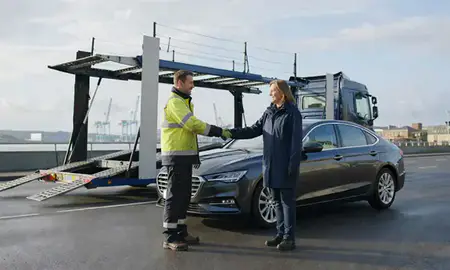 Vehicle owner beside their delivered car in Greenock, Inverclyde, United Kingdom