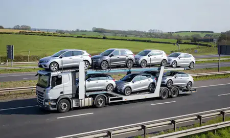 Multi-level car carrier on the motorway to Ashford, Kent, United Kingdom