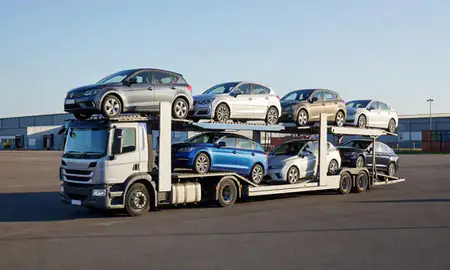 Car transporter loaded with vehicles in Ashford, Kent, United Kingdom
