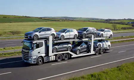 Multi-level car carrier on the motorway to Canterbury, Kent, United Kingdom