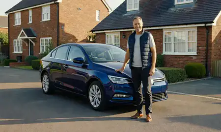 Customer with their delivered car in Canterbury, Kent, United Kingdom