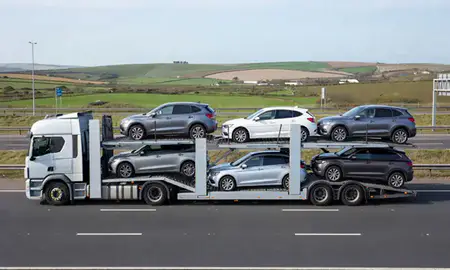 Multi-level car carrier on the motorway to Dover, Kent, United Kingdom