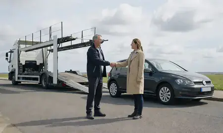 Vehicle owner beside their delivered car in Folkestone, Kent, United Kingdom