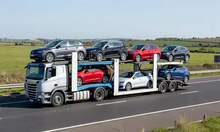 Multi-level car carrier on the motorway to Gillingham, Kent, United Kingdom