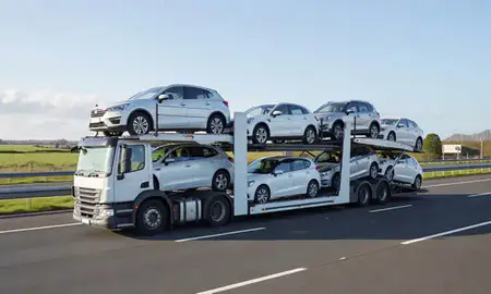 Multi-level car carrier on the motorway to Gravesend, Kent, United Kingdom