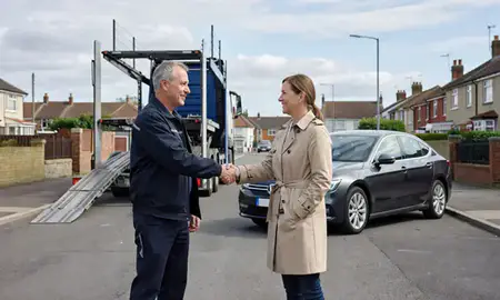 Vehicle owner beside their delivered car in Gravesend, Kent, United Kingdom