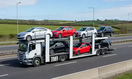 Multi-level car carrier on the motorway to Herne Bay, Kent, United Kingdom