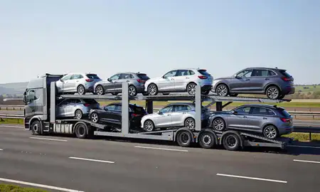 Multi-level car carrier on the motorway to Maidstone, Kent, United Kingdom
