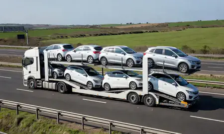 Multi-level car carrier on the motorway to Margate, Kent, United Kingdom