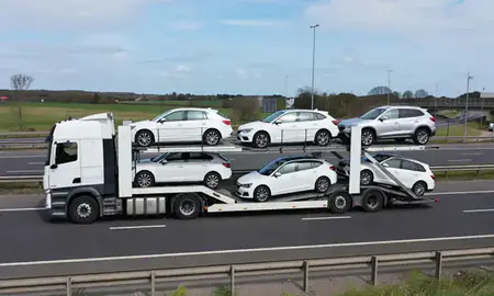 Multi-level car carrier on the motorway to Rochester, Kent, United Kingdom