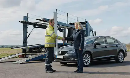 Vehicle owner beside their delivered car in Rochester, Kent, United Kingdom