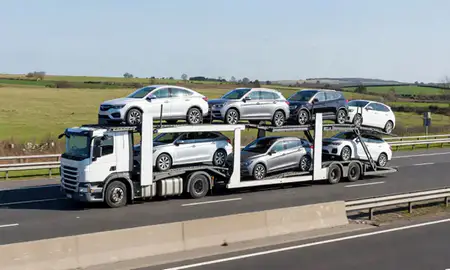 Multi-level car carrier on the motorway to Sittingbourne, Kent, United Kingdom