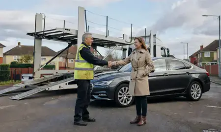 Vehicle owner beside their delivered car in Sittingbourne, Kent, United Kingdom