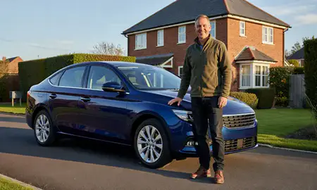 Customer with their delivered car in Tonbridge, Kent, United Kingdom