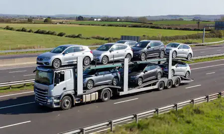 Multi-level car carrier on the motorway to Bamber Bridge, Lancashire, United Kingdom