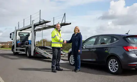 Vehicle owner beside their delivered car in Bamber Bridge, Lancashire, United Kingdom
