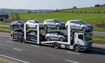 Multi-level car carrier on the motorway to Blackburn, Lancashire, United Kingdom