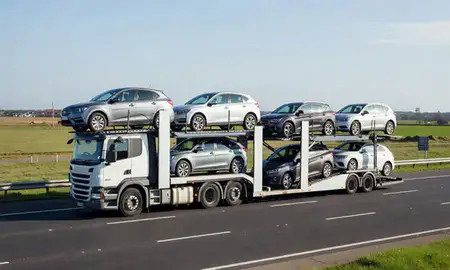 Multi-level car carrier on the motorway to Blackpool, Lancashire, United Kingdom