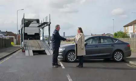 Vehicle owner beside their delivered car in Blackpool, Lancashire, United Kingdom