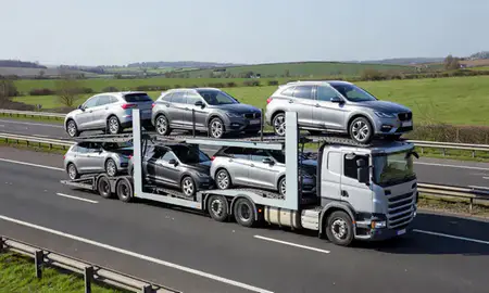Multi-level car carrier on the motorway to Chorley, Lancashire, United Kingdom