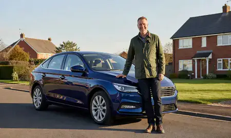 Customer with their delivered car in Chorley, Lancashire, United Kingdom