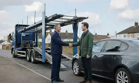 Vehicle owner beside their delivered car in Chorley, Lancashire, United Kingdom